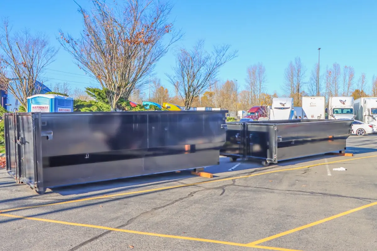 Professional dumpster rental service with roll-off container on residential driveway in Glendora